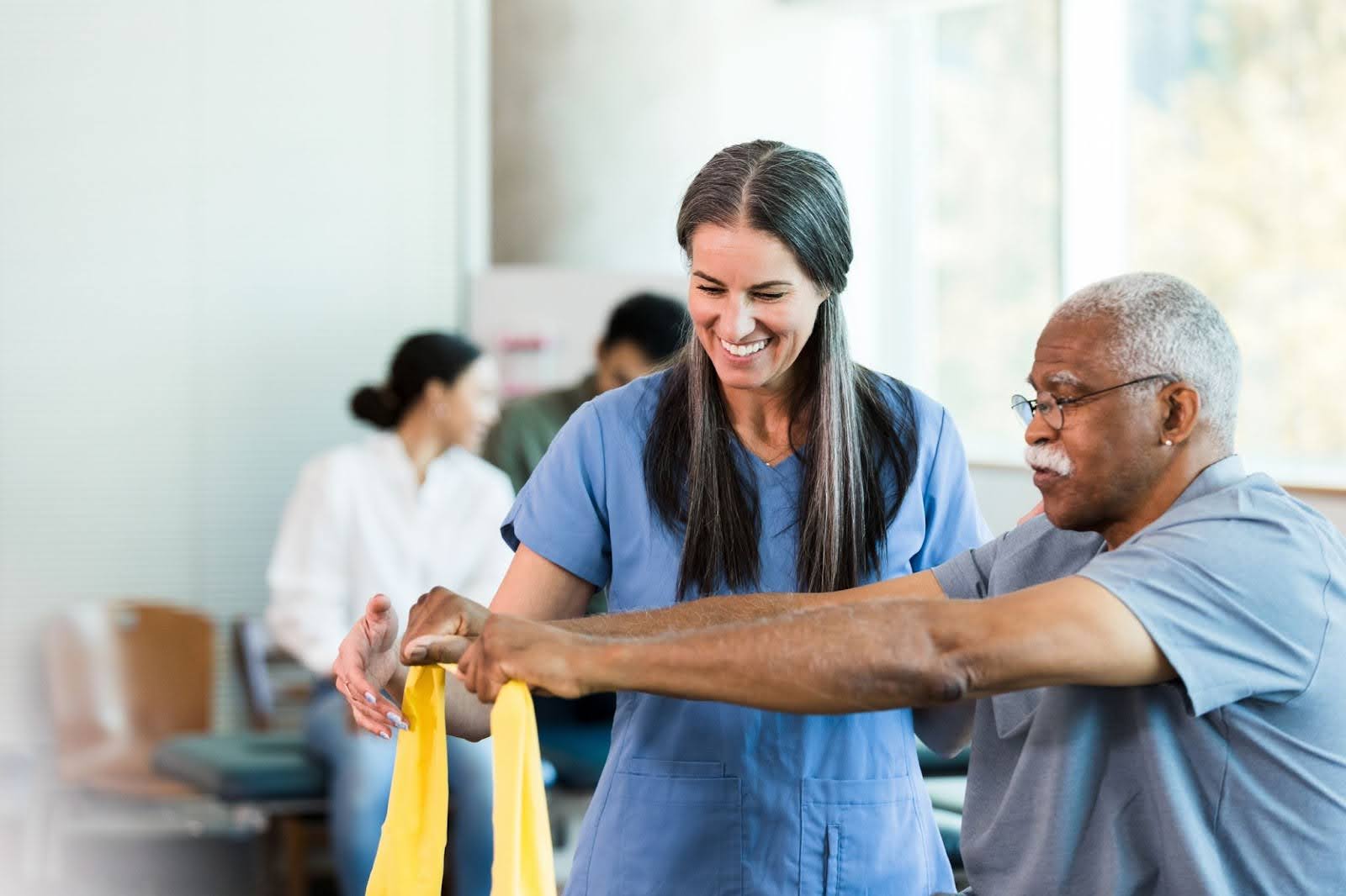 senior in physical therapy with therapist